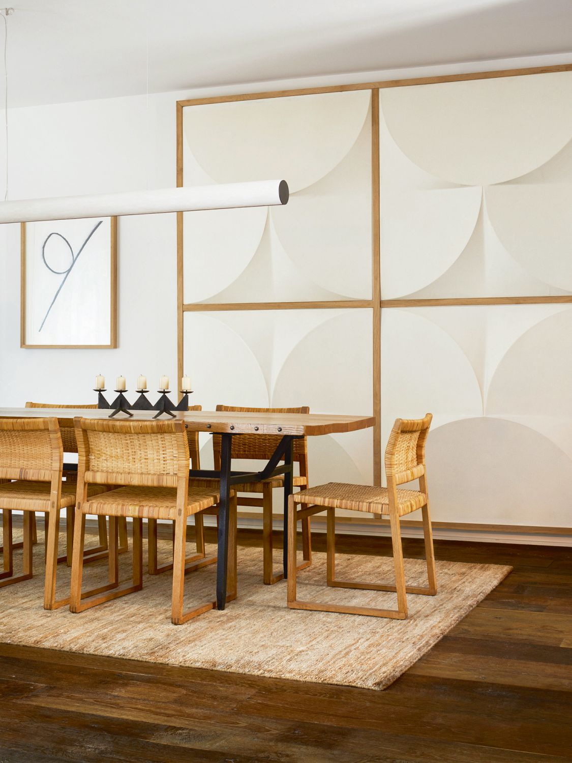 Wall panels produced by Maisonjaune Studio add an interesting facet to the dining area