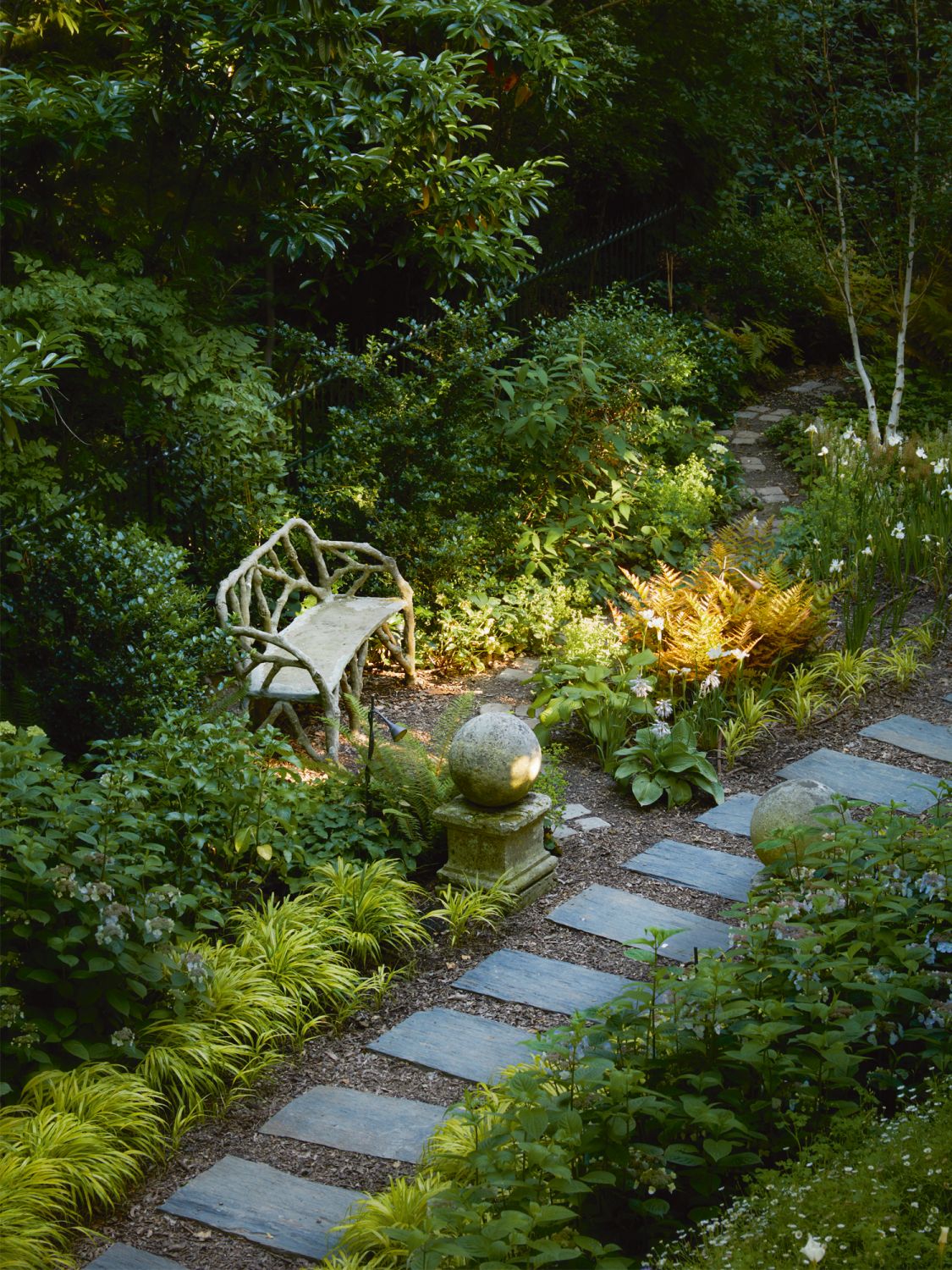 The tranquil garden is among the enviable features of this property