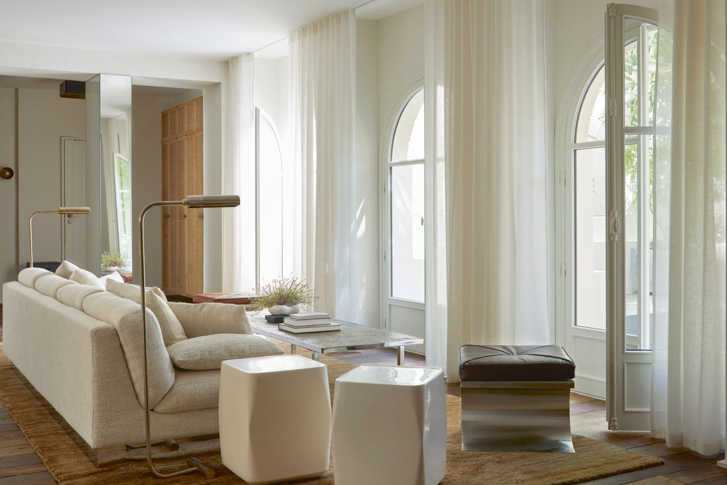 The breezy living room is awash in neutral hues