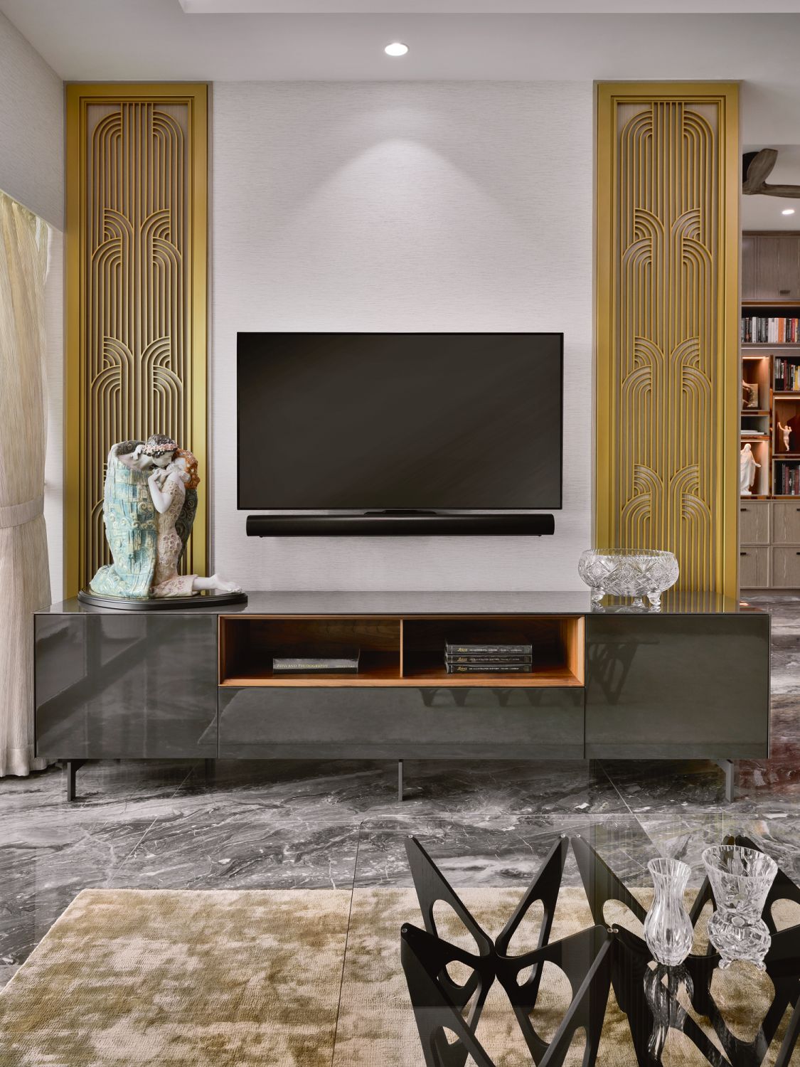 Decorative screens at the staircase and the living area are among the home’s most opulent details