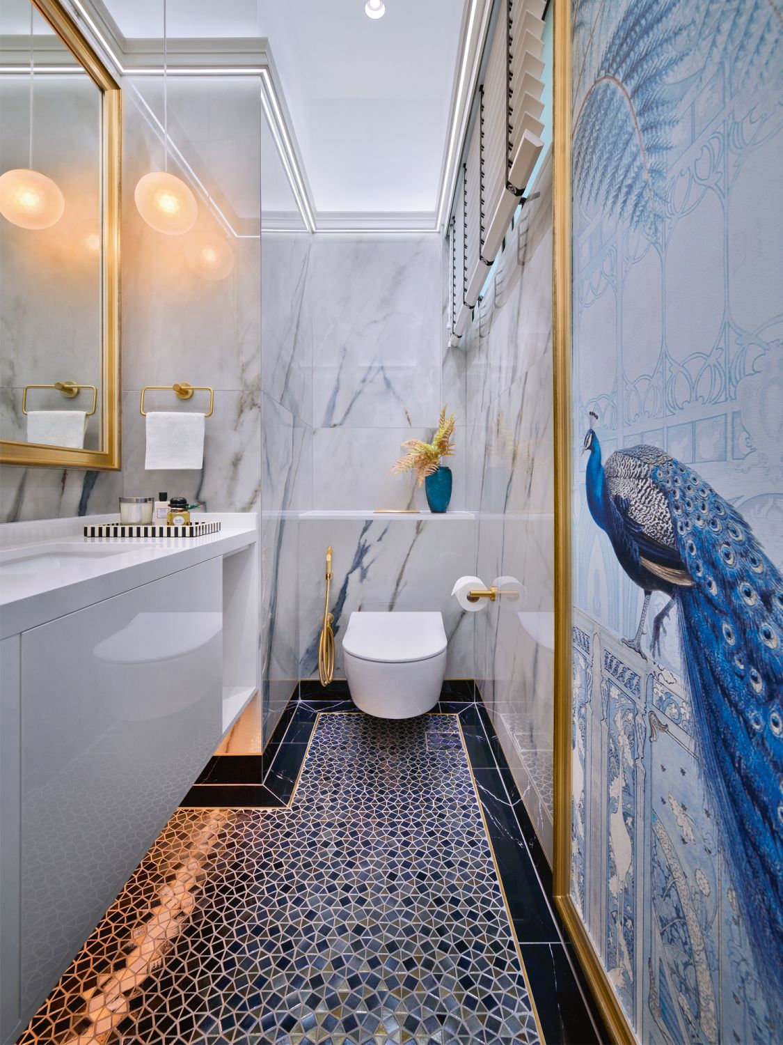 The peacock-themed powder room is a tribute to the free-roaming fowl of Sentosa Island