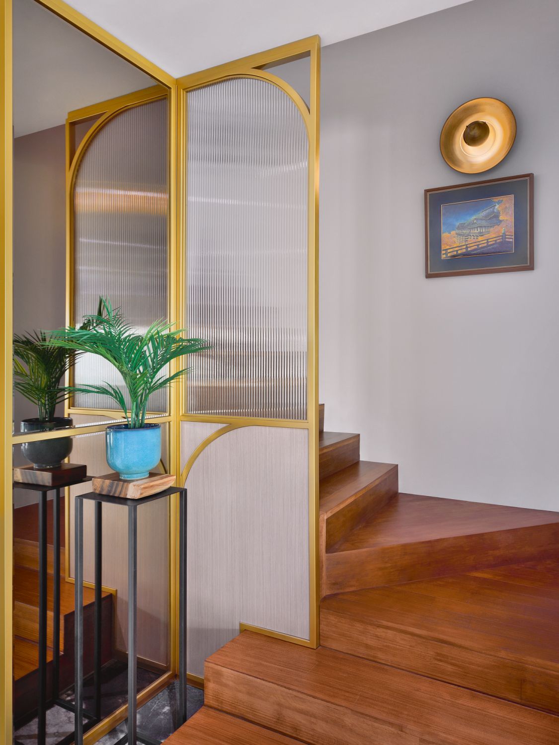 Decorative screens at the staircase and the living area are among the home’s most opulent details
