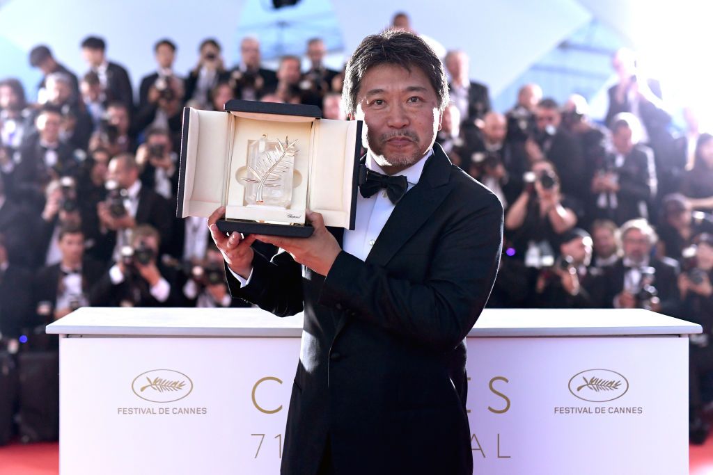 CANNES, FRANCE - MAY 19:  Director Hirokazu Koreeda poses with the Palme d'Or award for 'Shoplifters' (Manbiki Kazoku) at the photocall the Palme D'Or Winner during the 71st annual Cannes Film Festival at Palais des Festivals on May 19, 2018 in Cannes, France.  (Photo by Pascal Le Segretain/Getty Images)