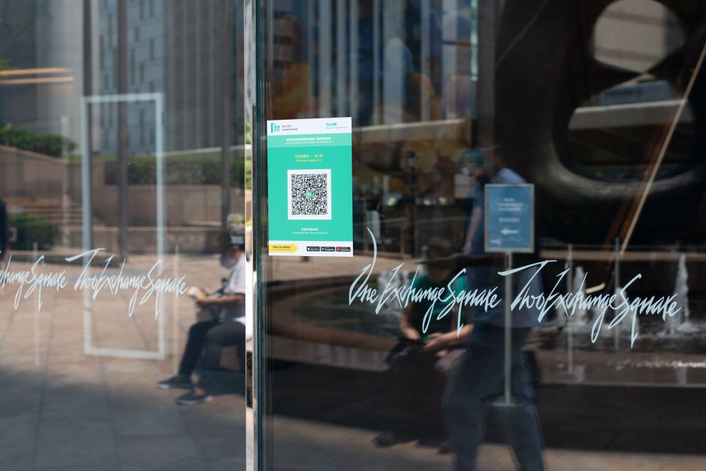 A QR code for the leave home safe app features on the entrance of the Hong Kong Exchange. (Photo by Marc Fernandes/NurPhoto via Getty Images)