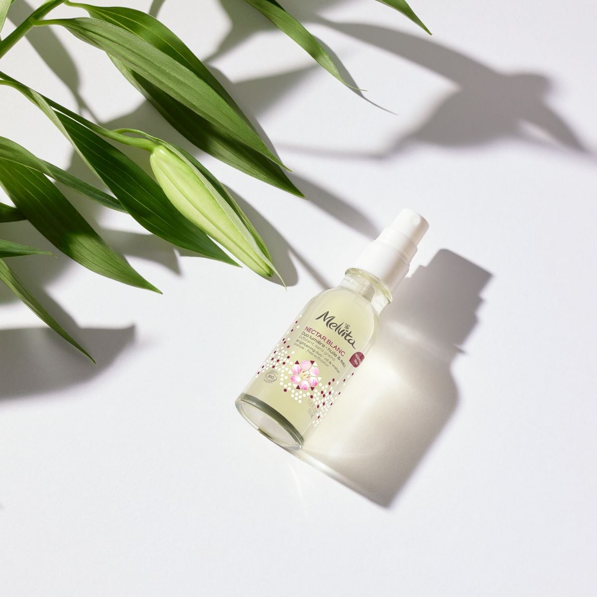 Melvita 百合花姸亮白雙效露(紫光限定版),50ml/NT$1,580