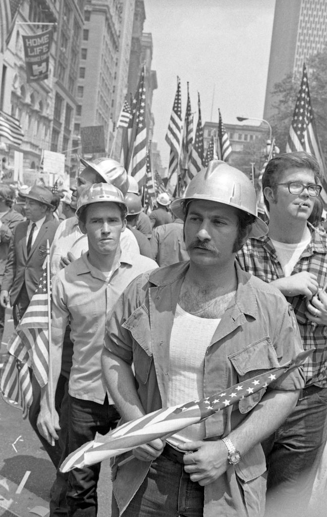 NYC Downtown Manhattan May 1970: World Trade Center construction workers and war veterans alike protest Mayor Lindsey's decision to lower the American Flags in memory of the victims of the Kent State Massacre.