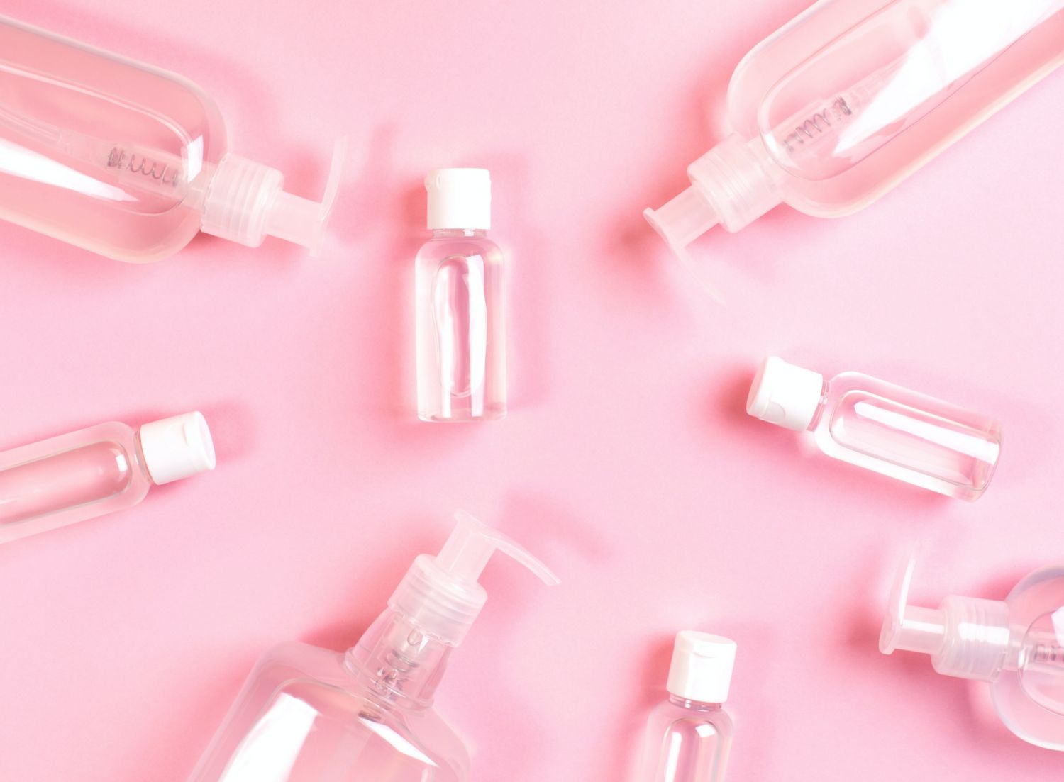 Group of transparent bottles with antibacterial gel inside. Hand Sanitiser Gel Mockup.