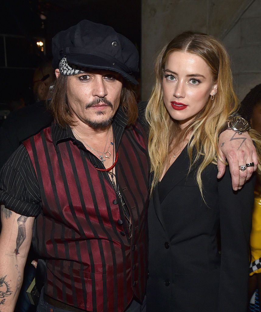 LOS ANGELES, CA - FEBRUARY 15: Actor/musician Johnny Depp (L) and actress Amber Heard attend The 58th GRAMMY Awards at Staples Center on February 15, 2016 in Los Angeles, California. (Photo by John Shearer/WireImage)