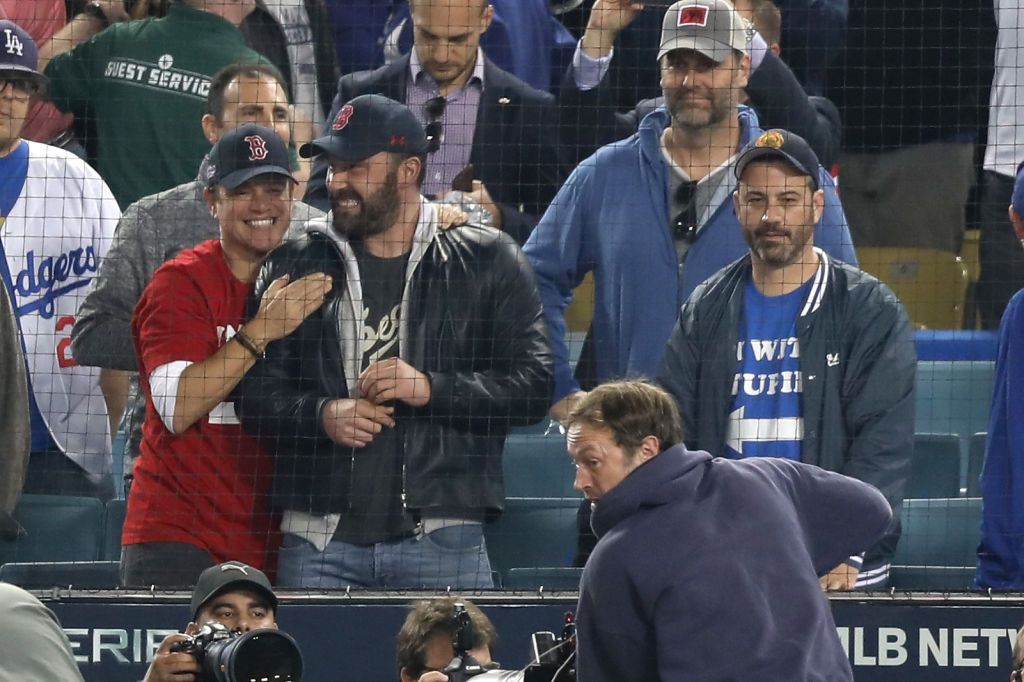 LOS ANGELES, CA - OCTOBER 28:  Jimmy Kimmel (R) looks on as Matt Damon and Ben Affleck celebrate the Boston Red Sox winning the World Series v The Los Angeles Dodgers - Game Five at Dodger Stadium on October 28, 2018 in Los Angeles, California.  (Photo by Jerritt Clark/Getty Images)