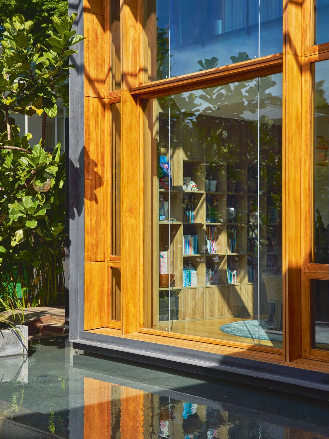 Full-height glass windows allow the study to be bathed in natural light