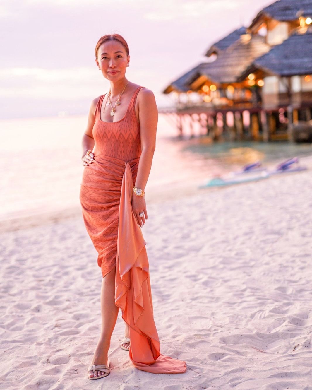Marga Nogalres in her printed rust swimsuit with the same print sarong skirt in silk