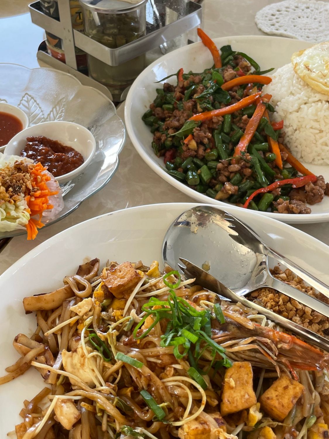 Fresh spring rolls, pad Thai, and stir-fried pork with basil from Wonderland Thai restaurant