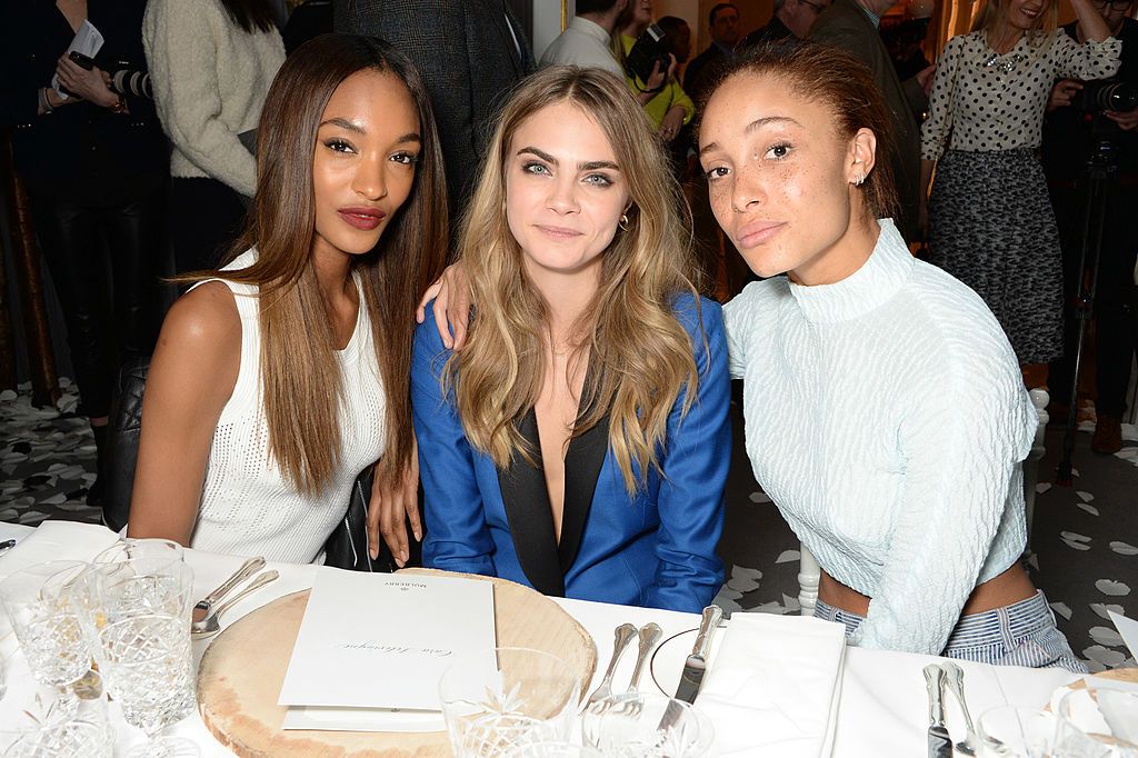 LONDON, ENGLAND - FEBRUARY 16: (L to R) Jourdan Dunn, Cara Delevingne and Adwoa Aboah attend the Mulberry dinner to celebrate the launch of the Cara Delevingne Collection at Claridge's Hotel on February 16, 2014 in London, England. (Photo by David M. Benett/Getty Images for Mulberry)
