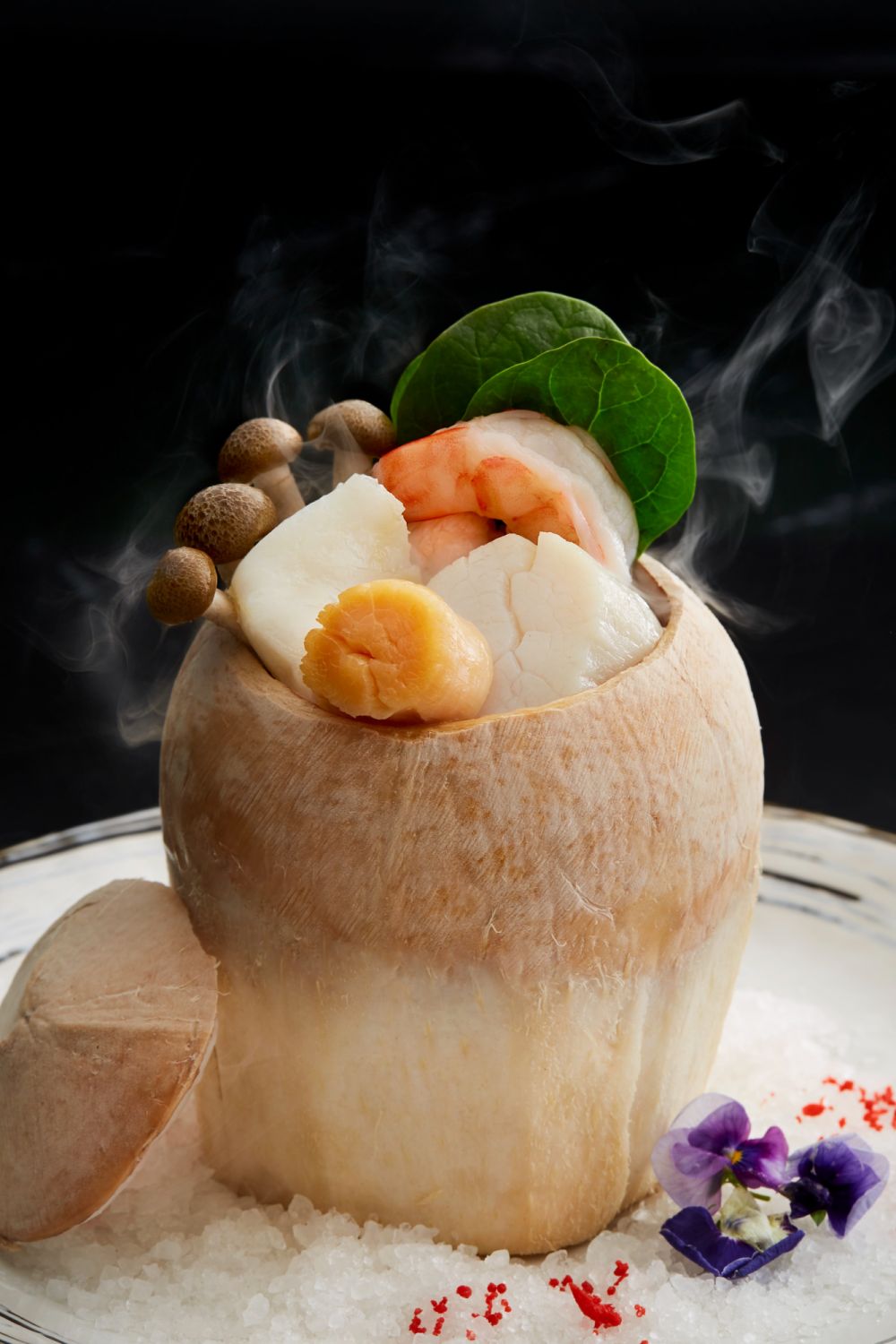 Double-boiled chicken consommé with prawn, scallops, enpiko and spinach in young coconut (Photo: Mandarin Oriental, Kuala Lumpur)