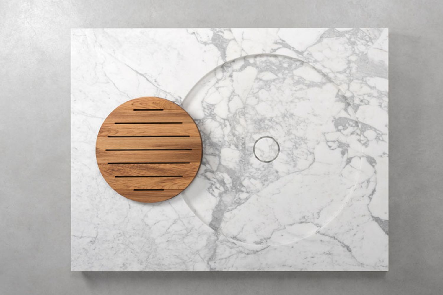 A sculptural sink that's part of the Vaselli’s H2O stone and metal bathroom collection by Irene Goldberg