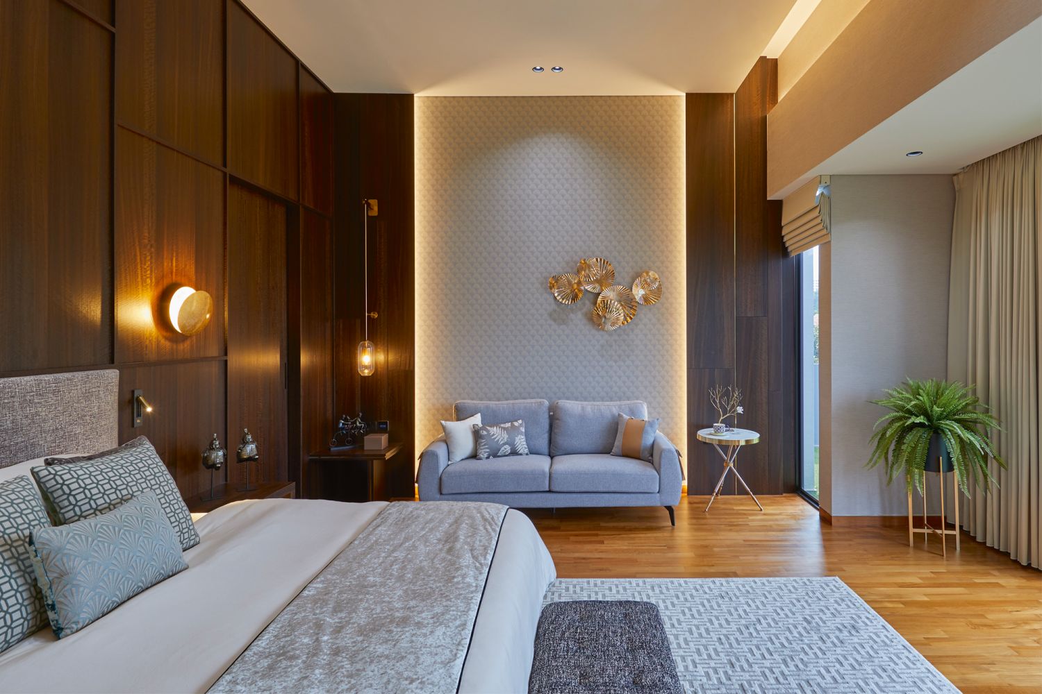 The master bedroom incorporates various indirect lighting elements inspired by hotel suites as well as sliding doors that lead to the separated his and hers wardrobe areas