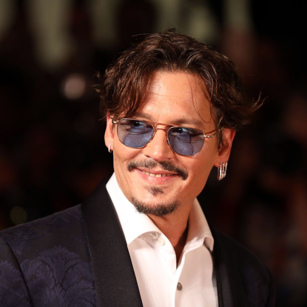 VENICE, ITALY - SEPTEMBER 06: (EDITORS NOTE: Retransmission with alternate crop.) Johnny Depp walks the red carpet ahead of the "Waiting For The Barbarians" screening during the 76th Venice Film Festival at Sala Grande on September 06, 2019 in Venice, Italy. (Photo by Tristan Fewings/Getty Images)