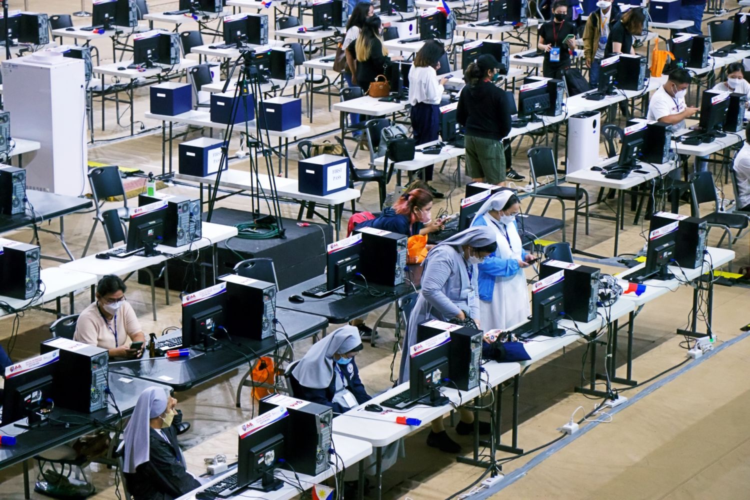 Volunteer manual encoders of PPCRV patiently wait for the 'fourth copy' of election returns from different districts