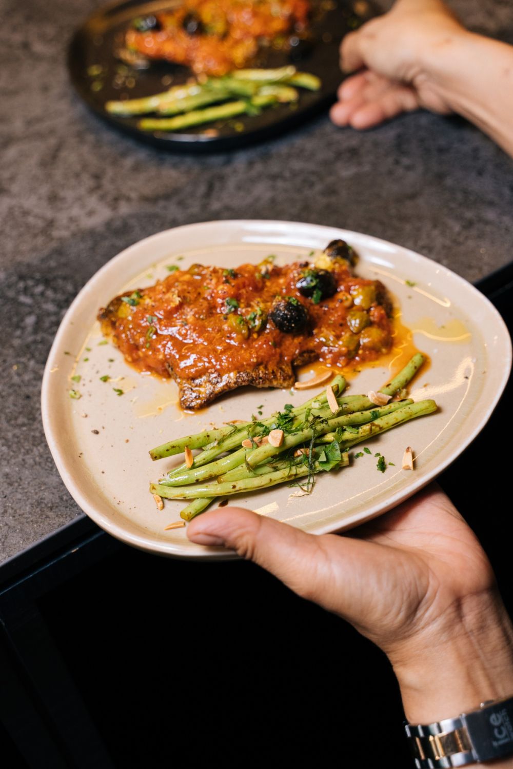 Sea Bass alla Puttanesca with sautéed Rapini