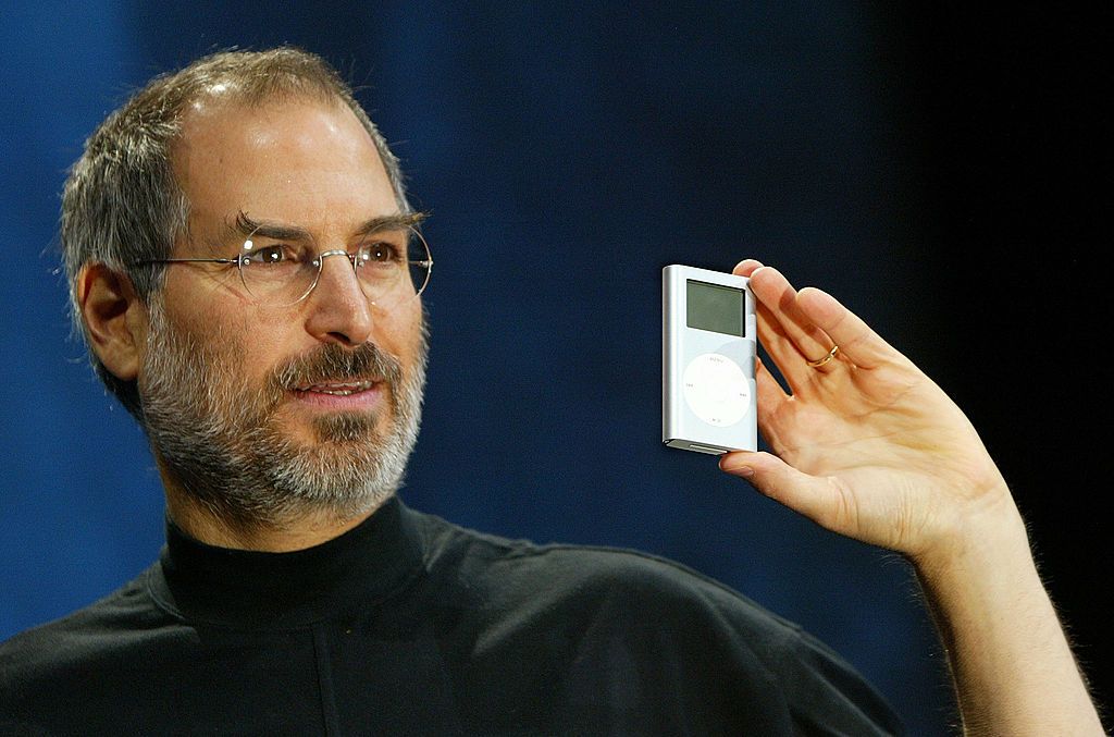 SAN FRANCISCO - JANUARY 6: Apple CEO Steve Jobs holds a new mini iPod at Macworld January 6, 2004 in San Francisco. Jobs announced several new products including the new iLife 4 software and the Mini iPod. (Photo by Justin Sullivan/Getty Images)