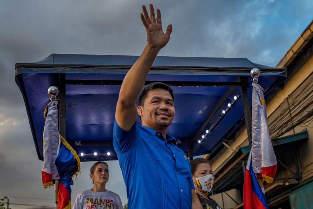 MANILA, PHILIPPINES - APRIL 09: Senator and boxing icon Manny Pacquiao takes part in a motorcade as he campaigns for the presidency on April 09, 2022 in Manila, Philippines. Pacquiao is trailing well behind in the latest opinion polls against frontrunner Ferdinand "Bongbong" Marcos Jr., the son and namesake of the late dictator Ferdinand Marcos, but has refused calls to back out from the presidential race amid alleged unity talks among candidates in a bid to stop another Marcos presidency. The former boxer