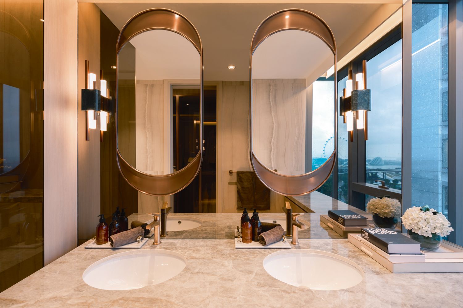 The use of mirrors expands the sense of space in the master bathroom