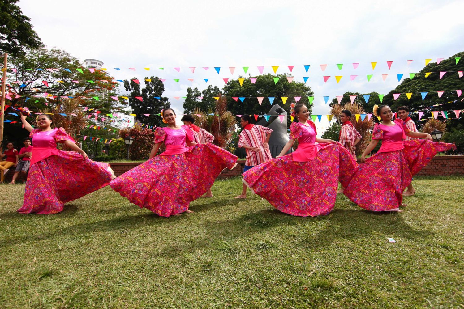 RIZAL PARK, MANILA, METRO MANILA, PHILIPPINES - 2018/05/20: Women perform Filipino dances while wearing native costumes made from indigenous materials. The Department of Tourism held a Flores de Mayo festival at the Rizal Park in Manila. The fiesta themed celebration was a showcase of Filipino games and native dances performed around the national park, Sunday afternoon. (Photo by J Gerard Seguia/SOPA Images/LightRocket via Getty Images)