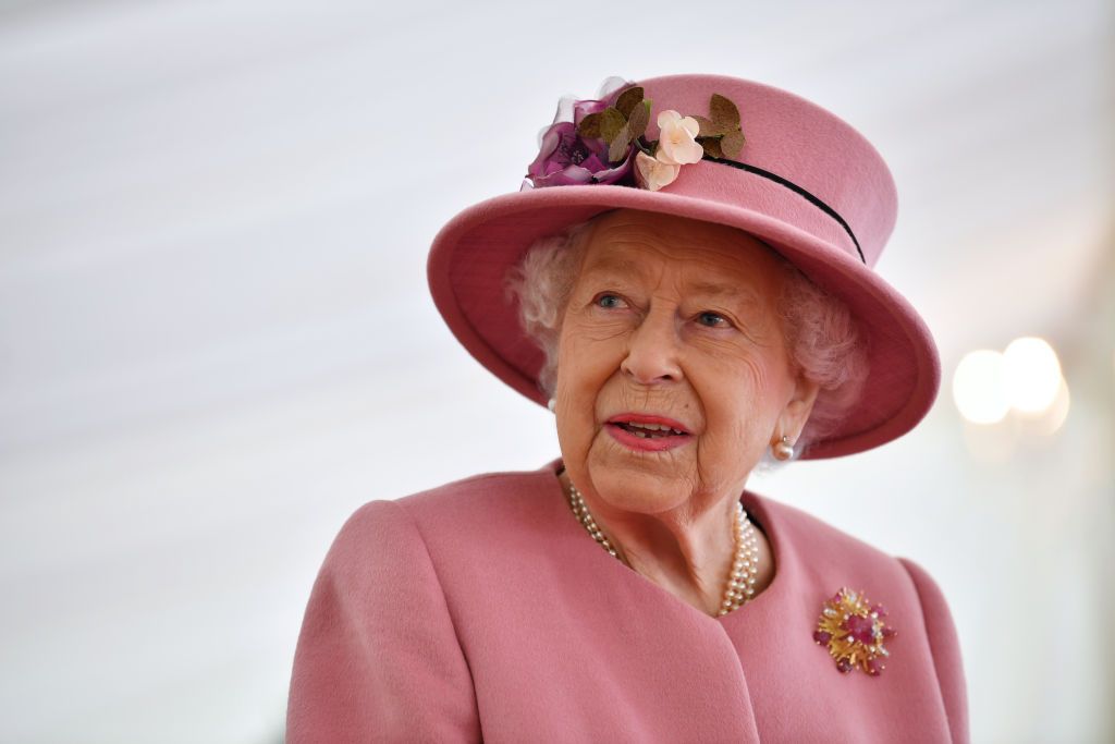 SALISBURY, ENGLAND - OCTOBER 15: Britain's Queen Elizabeth II speaks with staff during a visit to the Defence Science and Technology Laboratory (Dstl) at Porton Down science park on October 15, 2020 near Salisbury, England. The Queen and the Duke of Cambridge visited the Defence Science and Technology Laboratory (Dstl) where they were to view displays of weaponry and tactics used in counter intelligence, a demonstration of a Forensic Explosives Investigation and meet staff who were involved in the Salisbury