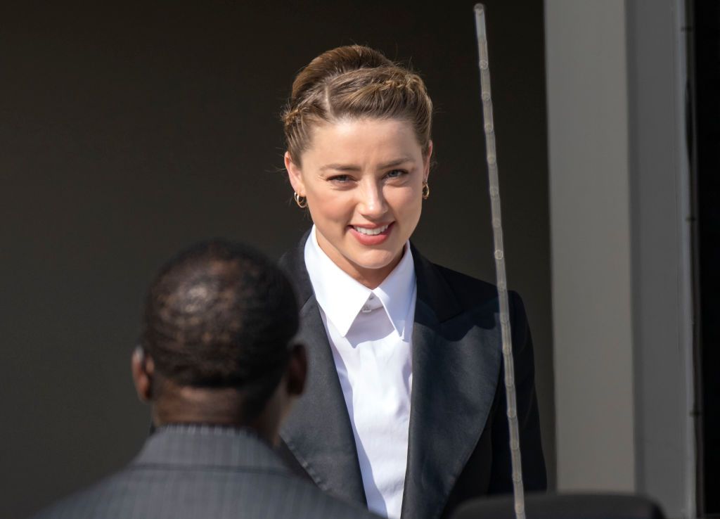 FAIRFAX, VA - MAY 3: (NY & NJ NEWSPAPERS OUT) Amber Heard departs following a recess for the day outside court during the Johnny Depp and Amber Heard civil trial at Fairfax County Circuit Court on May 3, 2022 in Fairfax, Virginia. Depp is seeking $50 million in alleged damages to his career over an op-ed Heard wrote in the Washington Post in 2018.(Photo by Ron Sachs/Consolidated News Pictures/Getty Images)