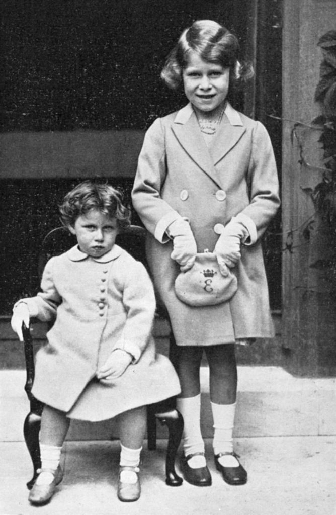 Princesses Elizabeth and Margaret, 1933. The future Queen Elizabeth II of Great Britain (b1926) standing alongside her younger sister. (Photo by Ann Ronan Pictures/Print Collector/Getty Images)