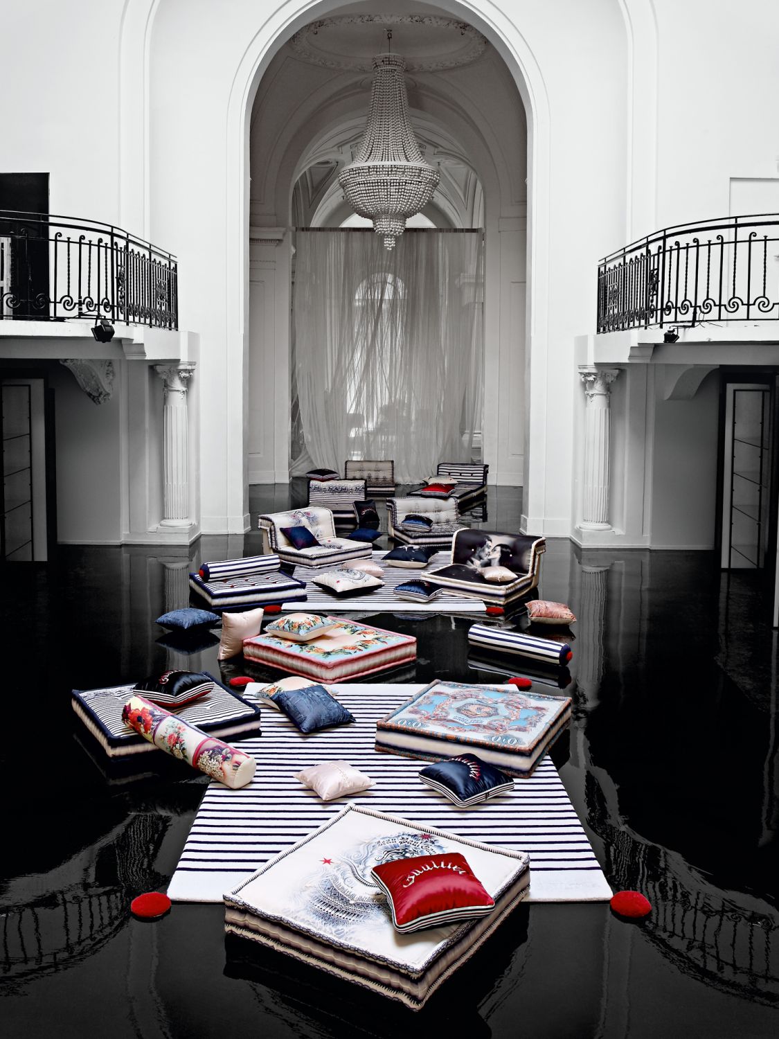 The designer's signature stripes can be found repeatedly in his exclusive fabrics for the Mah Jong sofa