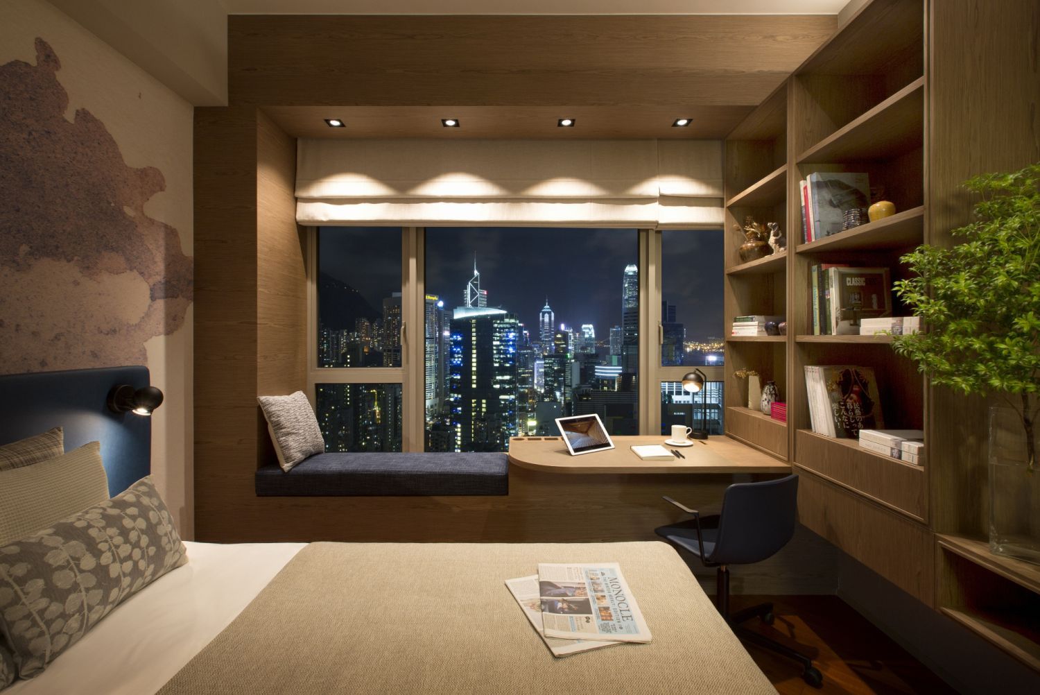 The master bedroom features an ingeniously transformed bay window that offers a peek at Hong Kong's cityscape (Photo: Almond Chu)