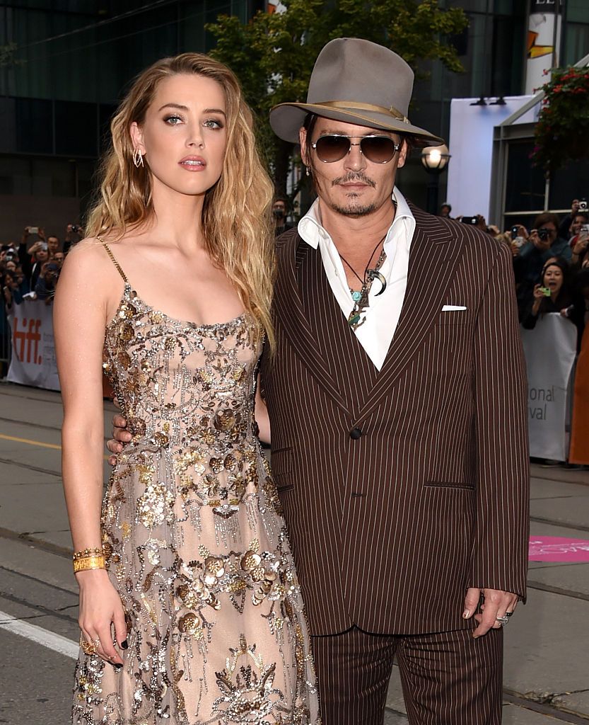 TORONTO, ON - SEPTEMBER 12: Actors Amber Heard (L) and Johnny Depp attend "The Danish Girl" premiere during the 2015 Toronto International Film Festival at the Princess of Wales Theatre on September 12, 2015 in Toronto, Canada. (Photo by Jason Merritt/Getty Images)