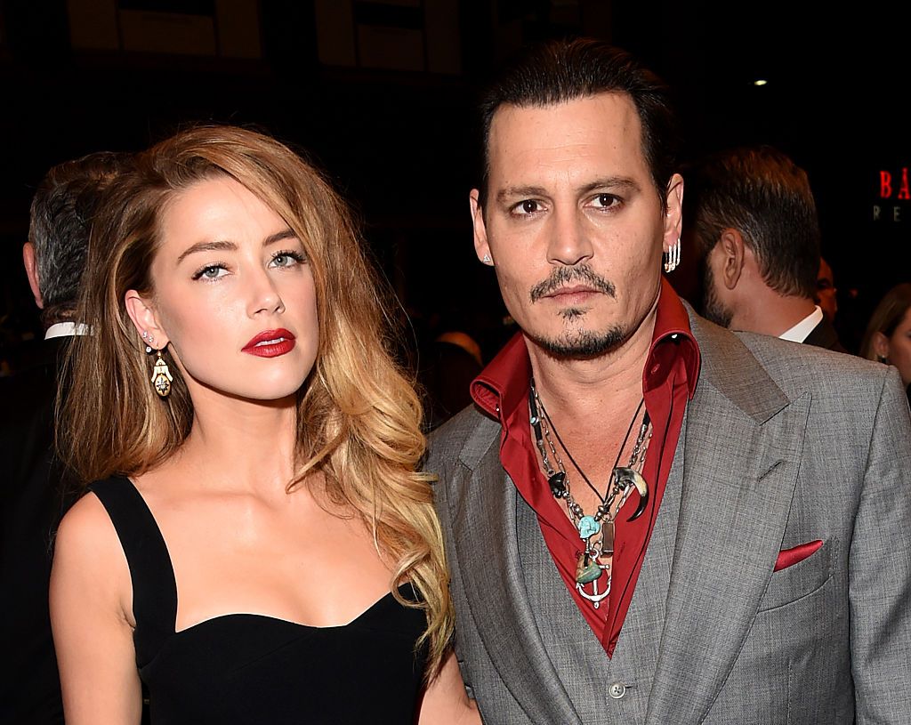 TORONTO, ON - SEPTEMBER 14: Actors Amber Heard (L) and Johnny Depp attend the "Black Mass" premiere during the 2015 Toronto International Film Festival at The Elgin on September 14, 2015 in Toronto, Canada. (Photo by Jason Merritt/Getty Images)