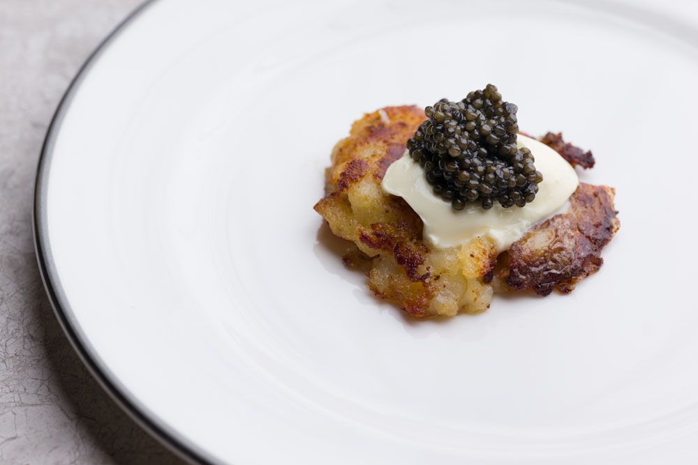 Smashed crusty Andean potatoes with smoked butter and Polanco caviar