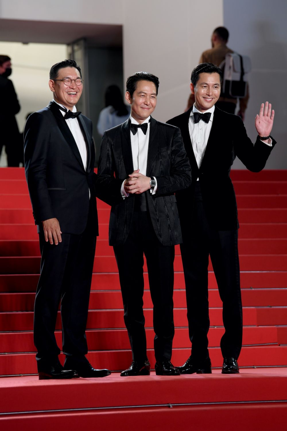 CANNES, FRANCE - MAY 19: Man-sik Jeong, Lee Jung-jae and Jung Woo-sung attend the screening of "Hunt" during the 75th annual Cannes film festival at Palais des Festivals on May 19, 2022 in Cannes, France. (Photo by John Phillips/Getty Images)