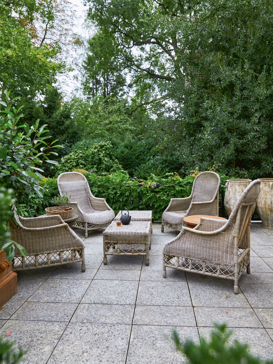 In the garden is a beautiful wicker furniture set from Octopus