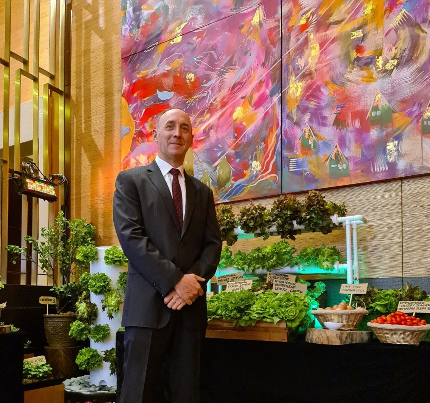City of Dreams Manila property president Geoff Andres leads the resort’s sustainability program. In the background are locally sourced fresh produce from hydroponics farms