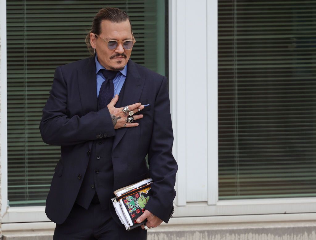 FAIRFAX, VIRGINIA - MAY 27: Actor Johnny Depp takes a break during his trial at a Fairfax County Courthouse on May 27, 2022 in Fairfax, Virginia. Closing arguments in the Depp v. Heard defamation trial, brought by Johnny Depp against his ex-wife Amber Heard, begins today. (Photo by Kevin Dietsch/Getty Images)