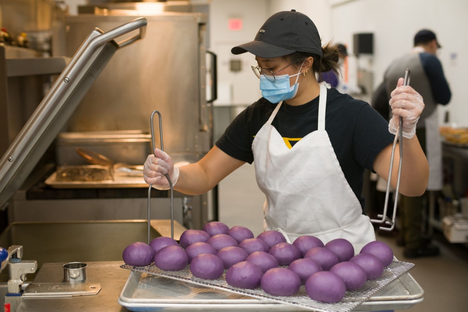Kimberly Camara preparing the ube doughnuts