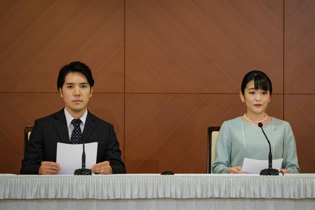 TOKYO, JAPAN - OCTOBER 26: Princess Mako (R), the elder daughter of Prince Akishino and Princess Kiko, and her husband Kei Komuro, a university friend of Princess Mako, deliver a speech during a press conference to announce their wedding at Grand Arc Hotel on October 26, 2021 in Tokyo, Japan. Princess Mako married Kei Komuro today at a registry office following a relationship beset with controversy following the revelation that Mr Komuroâs mother was embroiled in a financial dispute with a former fiancé.