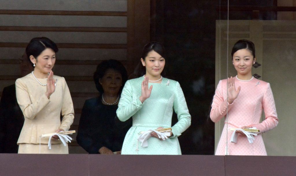 Princess Akishino Kiko (L), her daughter princess Mako (C), and princess Kako wave hands to well-wishers during New Year greeting on January 2, 2015 at the Imperial Palace in Tokyo, Japan. (Photo by KATSUMI KASAHARA/Gamma-Rapho via Getty Images)