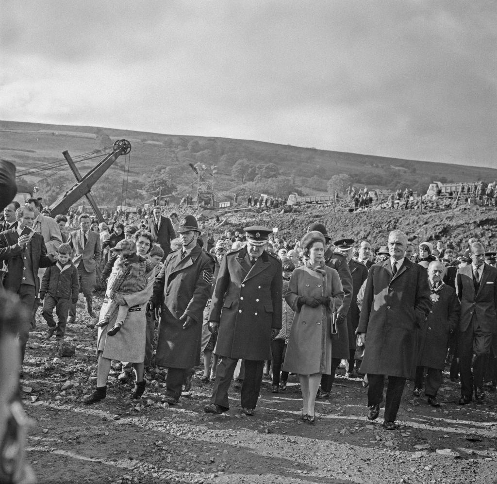 Queen Elizabeth II visits the coal mining village of Aberfan in Wales, following the disaster which resulted in the deaths of 116 children and 28 adults, UK, 29th October 1966. (Photo by Evening Standard/Hulton Archive/Getty Images)