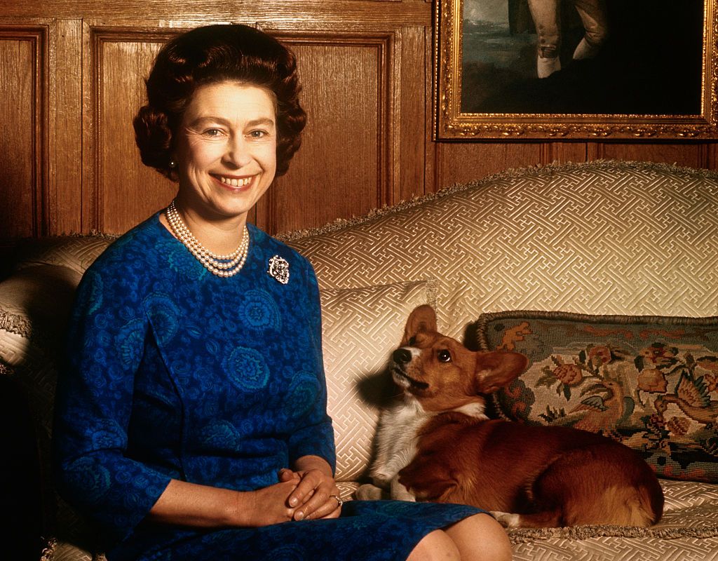 Queen Elizabeth pictured with a pet corgi in 1970. (Photo: Getty Images)