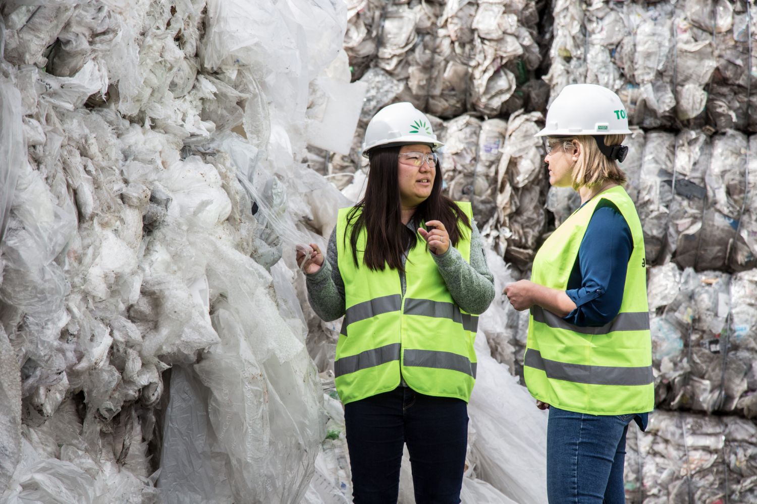 Miranda Wang (left) examines waste with Emily Hanson, Director of Business Development at GreenWaste Recovery.