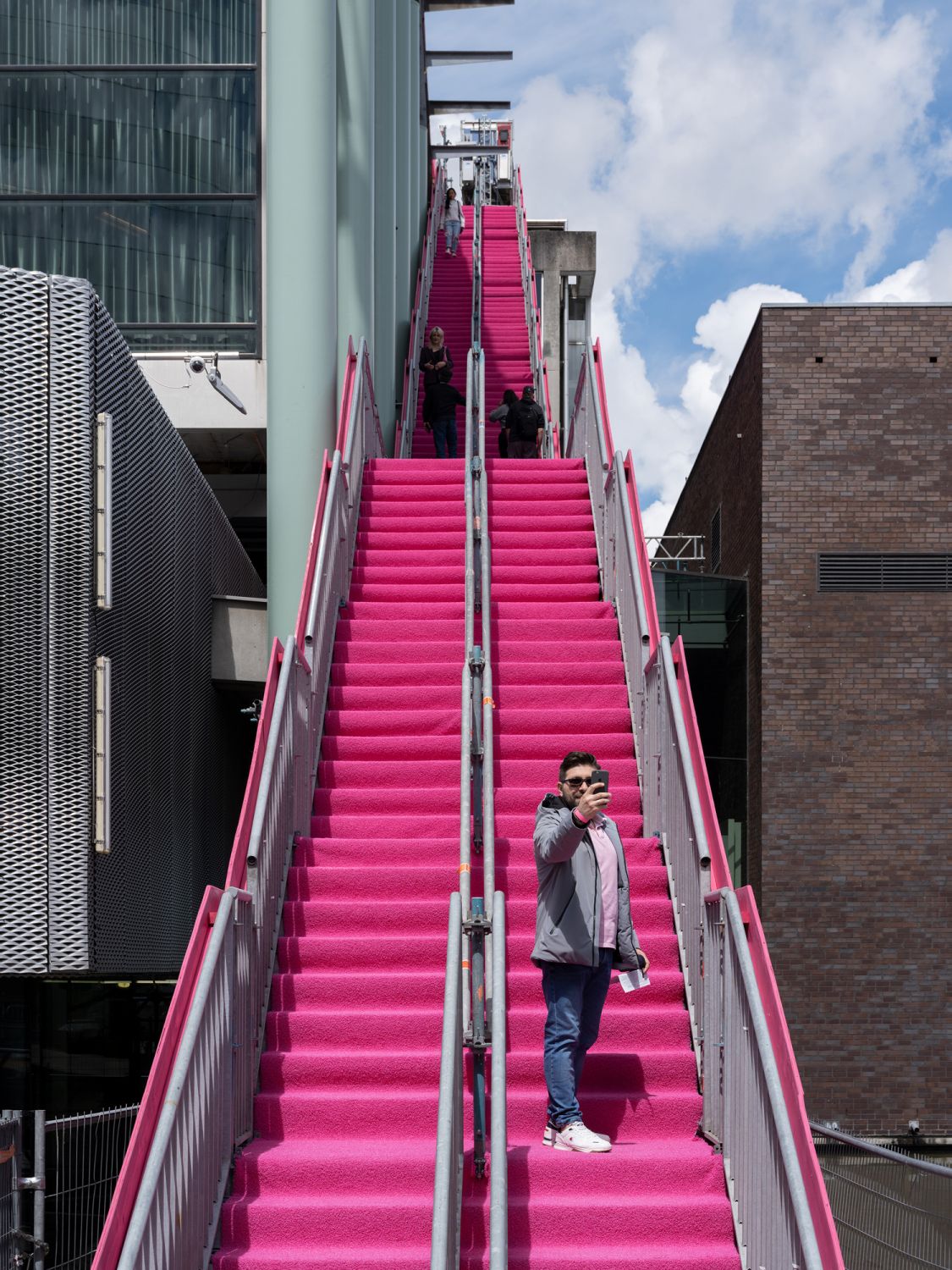 The pink roof is accessible via a 143-step external staircase that's coated in the same neon hue