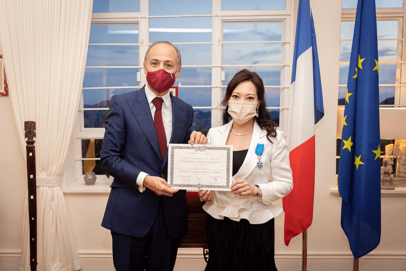 Eva Yu receives the Insignia of the Knight in the National Order of Merit
