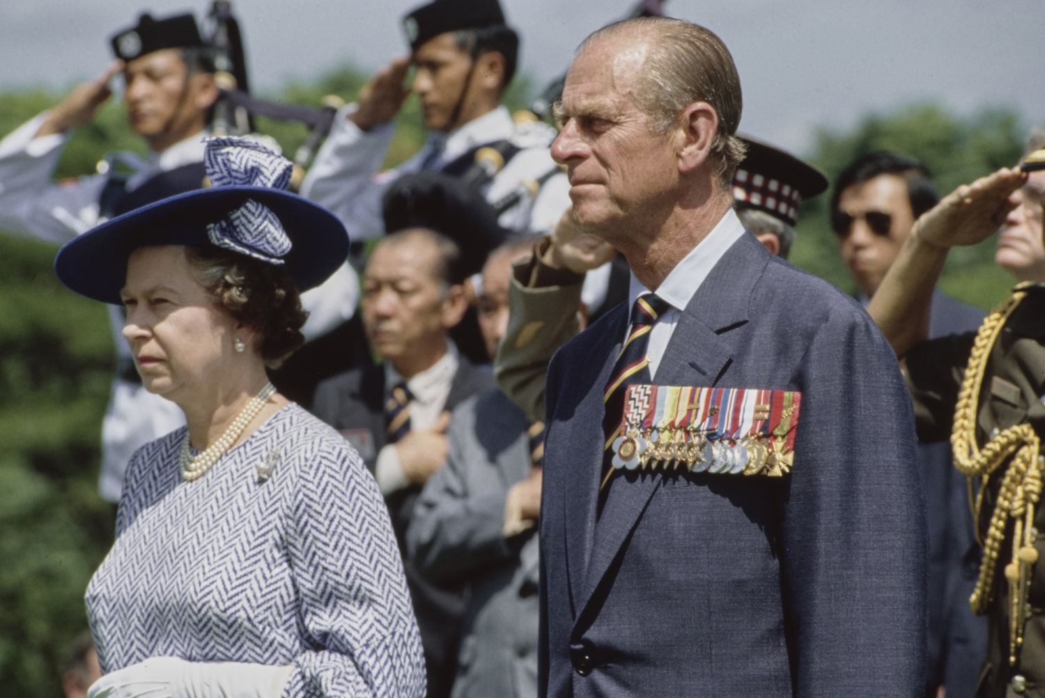 British Royal Queen Elizabeth II and Prince Philip, Duke of Edinburgh attend a wreath-laying ceremony at the Kranji War Memorial in the Kranji War Cemetery near Kranji on October 10, 1989. The Royal couple is on a three-day official visit to Singapore, en route to Malaysia, where the Queen opens the Commonwealth Heads of Government Meeting. (Photo: Getty Images)