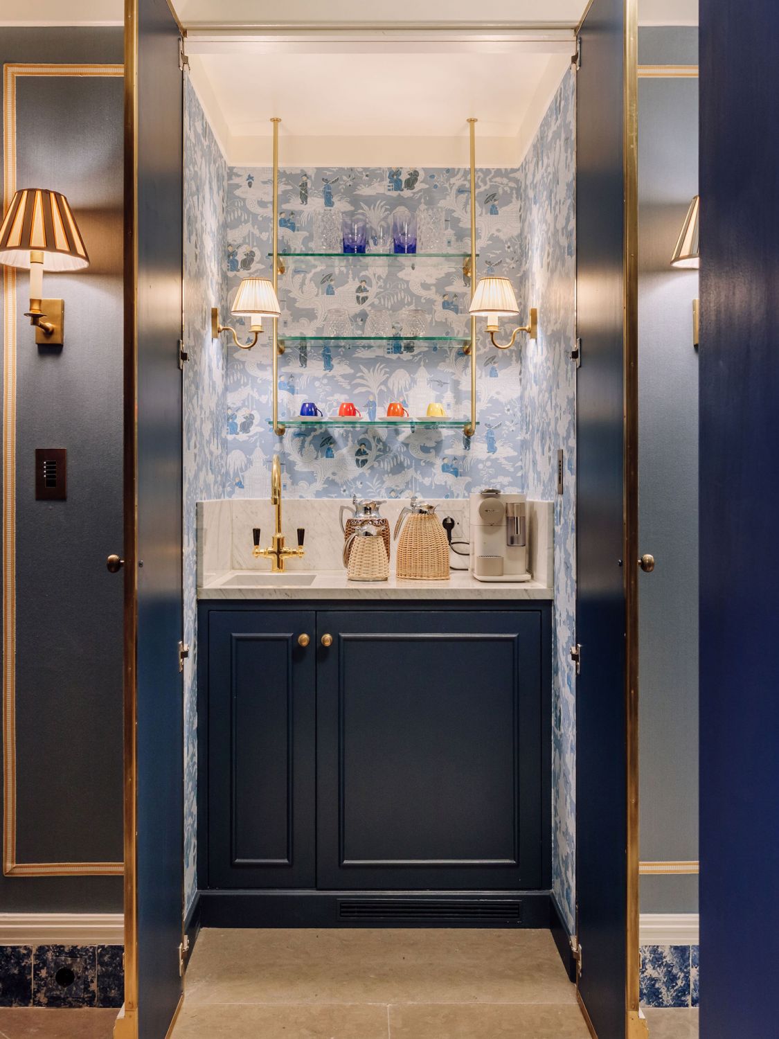 A coffee nook is cleverly hidden behind these doors