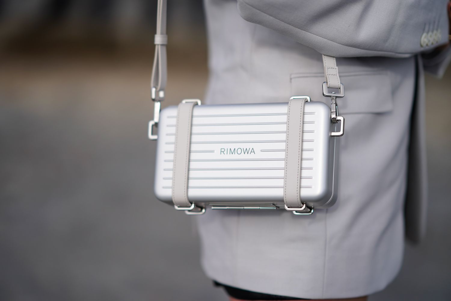 PARIS, FRANCE - FEBRUARY 25: A guest wears a metallic Rimowa bag, outside Dior, during Paris Fashion Week - Womenswear Fall/Winter 2020/2021, on February 25, 2020 in Paris, France. (Photo by Edward Berthelot/Getty Images)